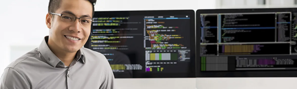 A man sitting in front of computer screen