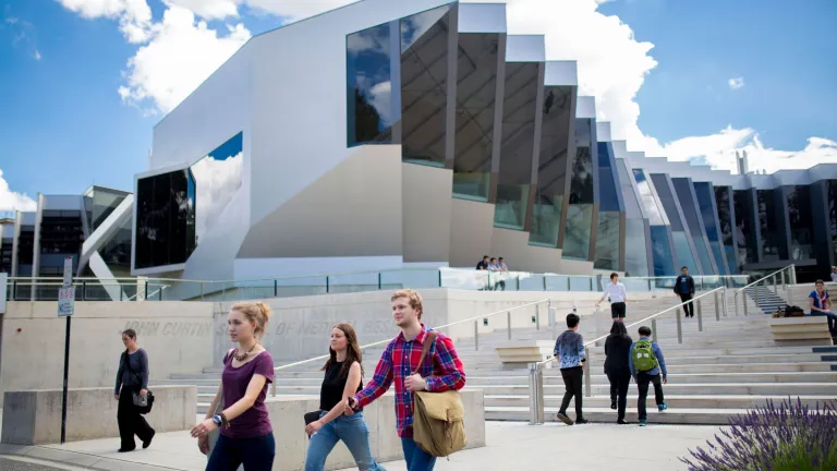 Students walking in front of the JCSMR building