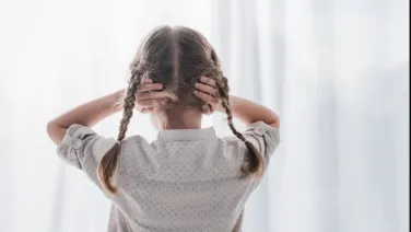 Child covering ears.LightField Studios